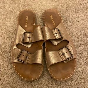 Trask gold and brown buckle up slides.